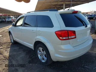 2014 Dodge Journey SE with VIN 3C4PDCAB4ET119412, listed as a IAAI auction lot 41760074 with 148,882 mi miles. Bid and sale history available at carsss.com. Image 3.