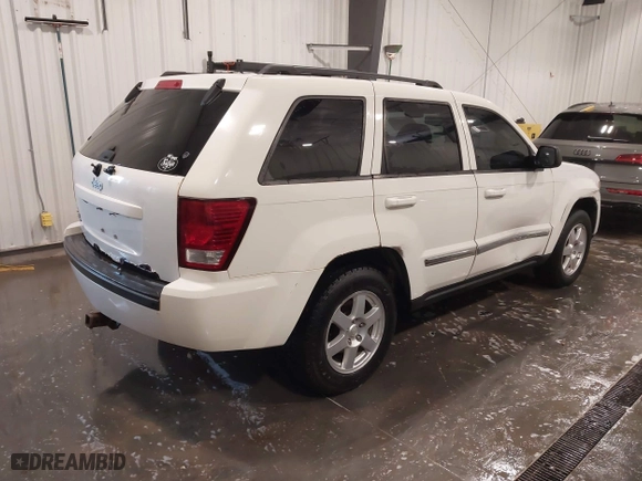 2010 Jeep Grand Cherokee Laredo with VIN 1J4PR4GK1AC143486, listed as a IAAI auction lot 41761763 with 159,139 mi miles. Bid and sale history available at carsss.com. Image 4.