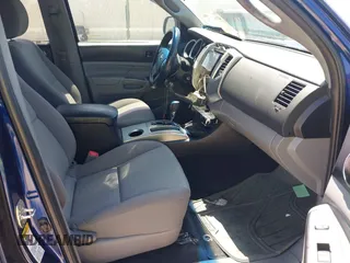 2014 Toyota Tacoma PreRunner with VIN 3TMJU4GN8EM157541, listed as a IAAI auction lot 41998374 with 113,830 mi miles. Bid and sale history available at carsss.com. Image 5.