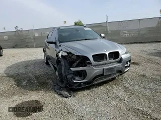 2012 BMW X6 50i z VIN 5UXFG8C53CL590367, wystawiony jako Copart lot #86650664 z przebiegiem Nie podano mil oraz Szkoda całkowita • Salvage title. Historia ofert i sprzedaży dostępna na DreamBid. Obrazek 11.