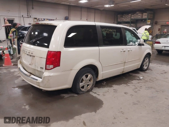 2012 Dodge Grand Caravan SXT with VIN 2C4RDGCG3CR405373, listed as a IAAI auction lot 41264407 with 164,019 mi miles and . Bid and sale history available at DreamBid. Image 4.