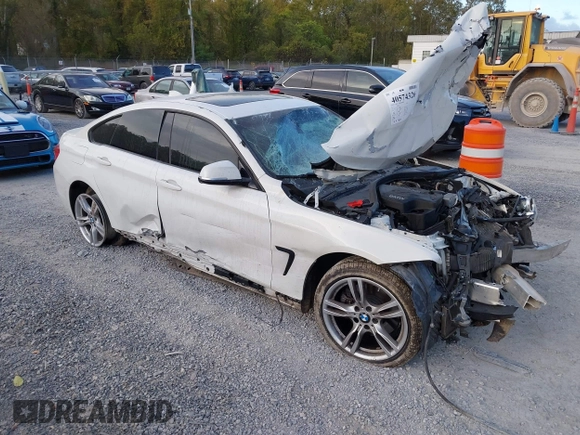 2015 BMW 4 Series 428i xDrive z VIN WBA4C9C57FD330866, wystawiony jako IAAI lot #40574326 z przebiegiem 123 726 mil mil oraz . Historia ofert i sprzedaży dostępna na DreamBid. Obrazek 1.