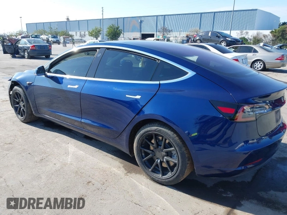 2018 Tesla Model 3 Long Range Battery with VIN 5YJ3E1EA4JF011799, listed as a IAAI auction lot 41765860 with 133,098 mi miles. Bid and sale history available at carsss.com. Image 3.