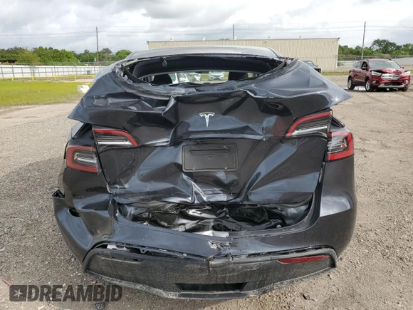 2024 Tesla Model Y с VIN 7SAYGDED4RA329638, выставлен на аукционе Copart как лот 54562525 с пробегом 8 606 миль миль и Списание • Salvage title. История ставок и продаж доступна на DreamBid. Изображение 6.