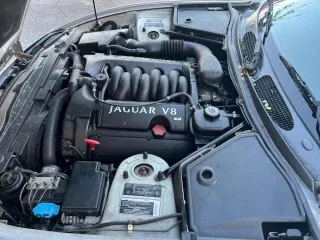 1999 Jaguar XK z VIN SAJGX204XXC041660, wystawiony jako Copart lot #88755785 z przebiegiem 70 091 mil mil oraz Tytuł czysty. Historia ofert i sprzedaży dostępna na DreamBid. Obrazek 7.