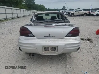 2001 Pontiac Grand Am with VIN 1G2NE12TX1M668035, listed as a Copart auction lot 59700585 with 60,965 mi miles and Salvage title. Bid and sale history available at DreamBid. Image 6.