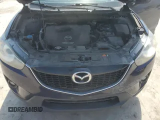 2014 Mazda CX-5 Touring z VIN JM3KE2CYXE0327950, wystawiony jako Copart lot #51390585 z przebiegiem 129 523 mil mil oraz Czysty tytuł • Clean title. Historia ofert i sprzedaży dostępna na DreamBid. Obrazek 12.