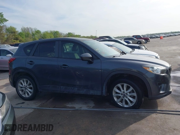 2014 Mazda CX-5 Grand Touring with VIN JM3KE2DY7E0345742, listed as a IAAI auction lot 41864116 with 158,746 mi miles. Bid and sale history available at carsss.com. Image 13.