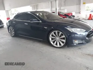 2014 Tesla Model S 60 with VIN 5YJSA1H11EFP60357, listed as a IAAI auction lot 42656130 with 133,344 mi miles and . Bid and sale history available at DreamBid. Image 1.