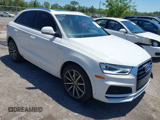 2018 Audi Q3 Premium z VIN WA1BCCFS2JR023605, wystawiony jako IAAI lot #42010774 z przebiegiem 73 651 mil mil oraz . Historia ofert i sprzedaży dostępna na DreamBid. Obrazek 1.