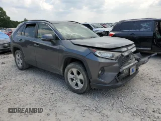 2019 Toyota RAV4 XLE with VIN JTMP1RFV8KD013125, listed as a Copart auction lot 59328465 with 106,947 mi miles and Salvage title. Bid and sale history available at DreamBid. Image 4.