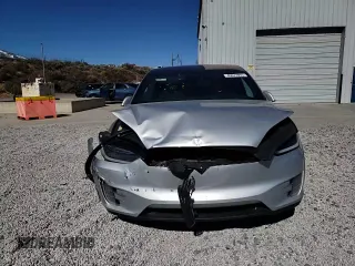 2016 Tesla Model X 70D with VIN 5YJXCAE29GF004033, listed as a Copart auction lot 49673975 with 220,259 mi miles and Salvage Title. Bid and sale history available at DreamBid. Image 11.