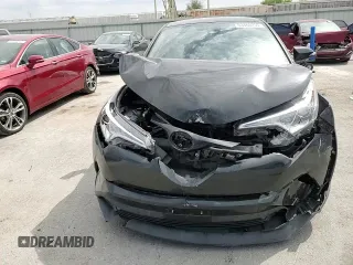 2018 Toyota C-HR XLE z VIN NMTKHMBX2JR036806, wystawiony jako Copart lot #53466255 z przebiegiem 66 915 mil mil oraz Szkoda całkowita • Salvage title. Historia ofert i sprzedaży dostępna na DreamBid. Obrazek 11.