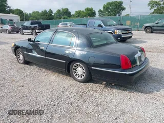 2001 Lincoln Town Car Signature with VIN 1LNHM82W11Y613959, listed as a IAAI auction lot 42432229 with 144,660 mi miles and . Bid and sale history available at DreamBid. Image 3.