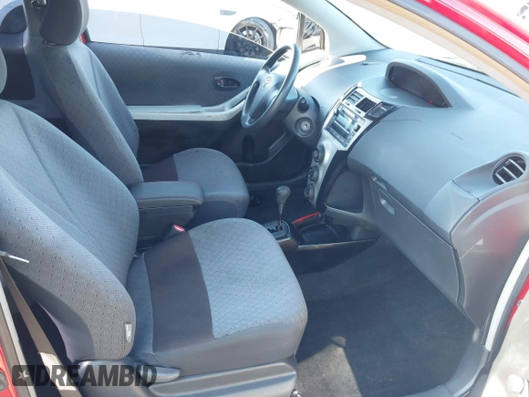 2009 Toyota Yaris with VIN JTDJT903695234623, listed as a IAAI auction lot 42027852 with 146,000 mi miles. Bid and sale history available at carsss.com. Image 5.