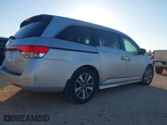 2014 Honda Odyssey Touring with VIN 5FNRL5H97EB094353, listed as a IAAI auction lot 41701712 with 141,228 mi miles and . Bid and sale history available at DreamBid. Image 4.