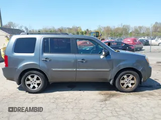2011 Honda Pilot Touring with VIN 5FNYF4H94BB035415, listed as a IAAI auction lot 42126738 with 239,273 mi miles. Bid and sale history available at carsss.com. Image 13.