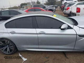 2014 BMW M6 z VIN WBS6C9C57ED467180, wystawiony jako IAAI lot #41461463 z przebiegiem 101 023 mil mil oraz . Historia ofert i sprzedaży dostępna na DreamBid. Obrazek 13.
