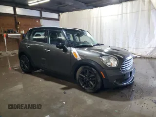 2014 MINI Countryman with VIN WMWZB3C59EWR42124, listed as a Copart auction lot 57830395 with 125,000 mi miles and Salvage title. Bid and sale history available at DreamBid. Image 4.