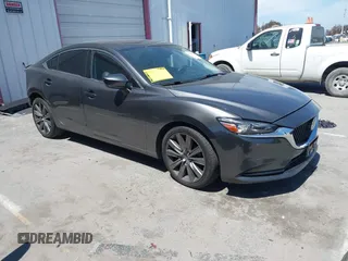 2018 Mazda Mazda6 Touring with VIN JM1GL1VM1J1320592, listed as a IAAI auction lot 41985616 with 100,920 mi miles. Bid and sale history available at carsss.com. Image 1.