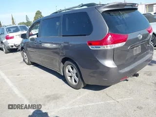 2014 Toyota Sienna LE AAS with VIN 5TDKK3DC6ES521706, listed as a IAAI auction lot 41999188 with 104,867 mi miles. Bid and sale history available at carsss.com. Image 3.