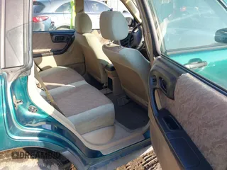 1999 Subaru Forester L with VIN JF1SF635XXH735202, listed as a IAAI auction lot 41489355 with 290,000 mi miles. Bid and sale history available at carsss.com. Image 8.
