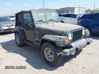 1998 Jeep Wrangler SE with VIN 1J4FY29P1WP806244, listed as a IAAI auction lot 41885627 with 131,486 mi miles. Bid and sale history available at carsss.com. Image 1.