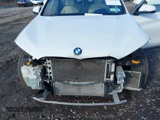 2018 BMW X1 xDrive28i with VIN WBXHT3C34J5L29714, listed as a IAAI auction lot 41825126 with 89,970 mi miles. Bid and sale history available at carsss.com. Image 6.
