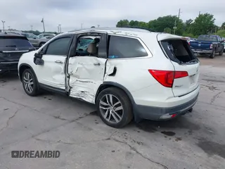 2016 Honda Pilot Elite with VIN 5FNYF6H00GB104329, listed as a IAAI auction lot 41905390 with 125,501 mi miles. Bid and sale history available at carsss.com. Image 3.
