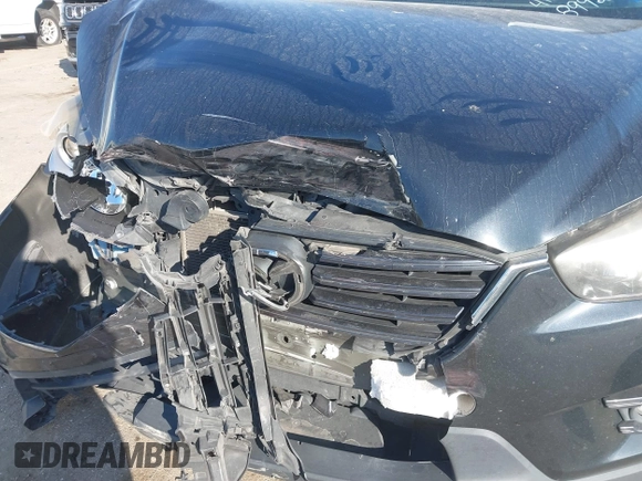 2016 Mazda CX-5 Touring with VIN JM3KE2CY6G0808992, listed as a IAAI auction lot 40969655 with 132,513 mi miles. Bid and sale history available at carsss.com. Image 6.
