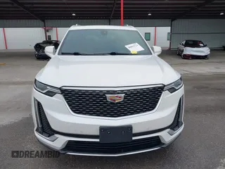2021 Cadillac XT6 Premium Luxury z VIN 1GYKPCRS8MZ233209, wystawiony jako IAAI lot #40012714 z przebiegiem 45 599 mil mil oraz . Historia ofert i sprzedaży dostępna na DreamBid. Obrazek 12.