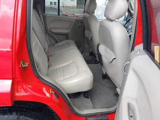 2002 Jeep Liberty Limited z VIN 1J8GL58K42W262492, wystawiony jako IAAI lot #42121270 z przebiegiem 167 662 mil mil oraz . Historia ofert i sprzedaży dostępna na DreamBid. Obrazek 8.