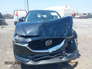 2020 Mazda CX-5 Grand Touring with VIN JM3KFADM9L1837183, listed as a IAAI auction lot 42340628 with 81,975 mi miles and . Bid and sale history available at DreamBid. Image 12.