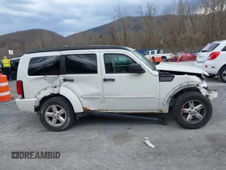 2007 Dodge Nitro SXT with VIN 1D8GU28K77W727391, listed as a IAAI auction lot 41869288 with 214,920 mi miles. Bid and sale history available at carsss.com. Image 13.