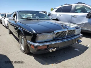 1990 Jaguar XJ with VIN SAJKY1745LC622713, listed as a Copart auction lot 56545414 with Not Provided miles and Salvage Title. Bid and sale history available at DreamBid. Image 4.