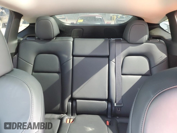 2024 Tesla Model Y with VIN 7SAYGDED0RF131495, listed as a Copart auction lot 56849765 with 10,120 mi miles and Salvage title. Bid and sale history available at DreamBid. Image 10.