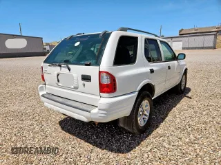 2004 Isuzu Rodeo S z VIN 4S2CK58W544313903, wystawiony jako Copart lot #57535585 z przebiegiem 121 385 mil mil oraz Tytuł czysty. Historia ofert i sprzedaży dostępna na DreamBid. Obrazek 4.