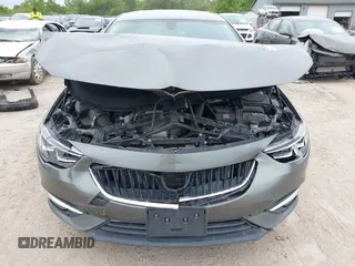 2019 Buick Regal Essence with VIN W04GP6SX6K1009087, listed as a IAAI auction lot 42318056 with 67,460 mi miles and . Bid and sale history available at DreamBid. Image 6.