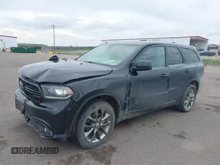 2014 Dodge Durango SXT with VIN 1C4RDJAG1EC552075, listed as a IAAI auction lot 42292301 with 122,427 mi miles and . Bid and sale history available at DreamBid. Image 2.