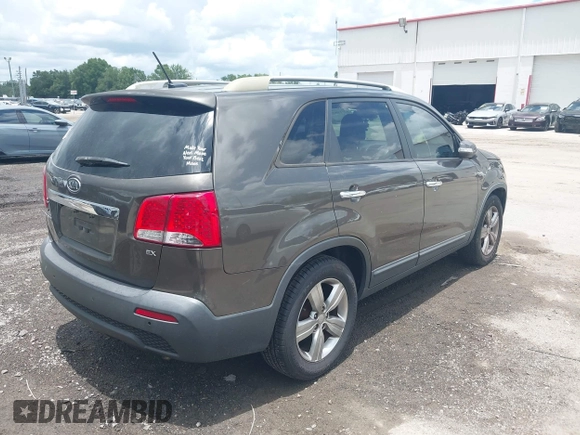 2013 Kia Sorento EX with VIN 5XYKU3A69DG318488, listed as a IAAI auction lot 42618875 with 221,080 mi miles and . Bid and sale history available at DreamBid. Image 4.