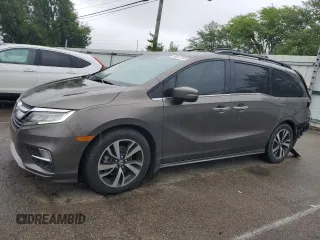 2018 Honda Odyssey Elite z VIN 5FNRL6H94JB107589, wystawiony jako Copart lot #58347385 z przebiegiem 98 761 mil mil oraz Szkody całkowita. Historia ofert i sprzedaży dostępna na DreamBid. Obrazek 1.