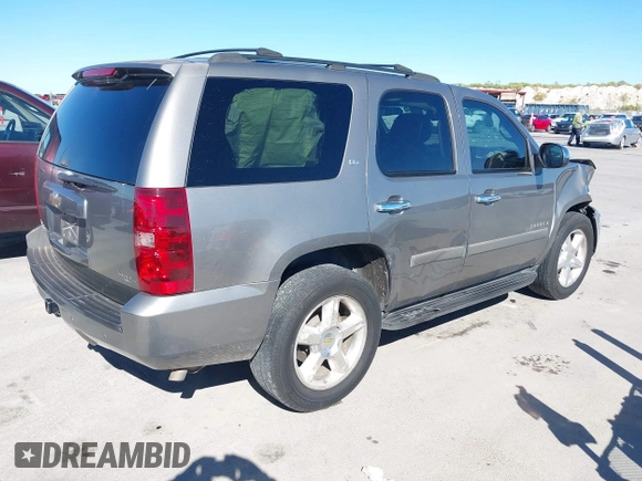 2007 Chevrolet Tahoe LTZ with VIN 1GNFC13J97R155705, listed as a IAAI auction lot 40914171 with 165,727 mi miles and . Bid and sale history available at DreamBid. Image 4.