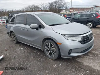 2021 Honda Odyssey Touring with VIN 5FNRL6H82MB009480, listed as a IAAI auction lot 41728056 with 84,577 mi miles. Bid and sale history available at carsss.com. Image 1.