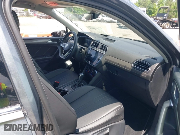 2023 Volkswagen Tiguan SE with VIN 3VV3B7AX3PM118743, listed as a IAAI auction lot 42291956 with 32,776 mi miles and . Bid and sale history available at DreamBid. Image 5.