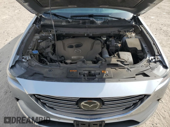 2020 Mazda CX-9 Grand Touring z VIN JM3TCADY0L0417673, wystawiony jako Copart lot #44625195 z przebiegiem 94 221 mil mil oraz Szkoda całkowita • Salvage title. Historia ofert i sprzedaży dostępna na DreamBid. Obrazek 12.
