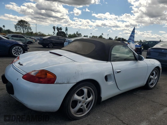 1999 Porsche Boxster z VIN WP0CA2984XU629987, wystawiony jako Copart lot #51366845 z przebiegiem Nie podano mil oraz Czysty tytuł • Clean title. Historia ofert i sprzedaży dostępna na DreamBid. Obrazek 3.