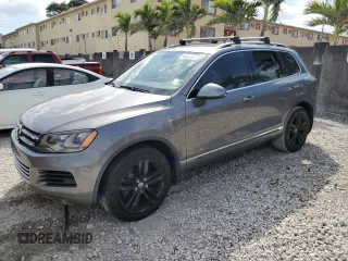 2012 Volkswagen Touareg Sport z VIN WVGFK9BP9CD001241, wystawiony jako Copart lot #48327975 z przebiegiem 145 906 mil mil oraz Czysty tytuł • Clean title. Historia ofert i sprzedaży dostępna na DreamBid. Obrazek 1.