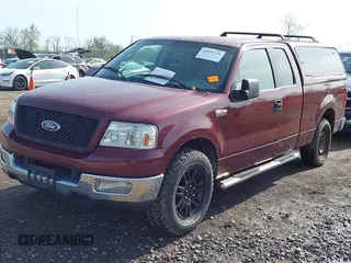 2005 Ford F-150 XLT with VIN 1FTPX12505FB69853, listed as a IAAI auction lot 42092756 with 330,699 mi miles. Bid and sale history available at carsss.com. Image 2.