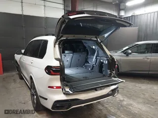 2023 BMW X7 xDrive40i with VIN 5UX23EM04P9P96036, listed as a IAAI auction lot 41235512 with 35,661 mi miles. Bid and sale history available at carsss.com. Image 3.