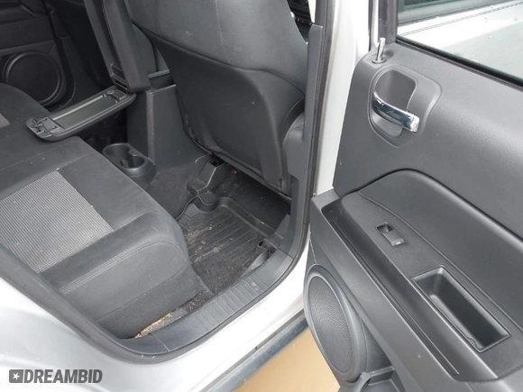 2011 Jeep Compass with VIN 1J4NF1FB6BD283741, listed as a IAAI auction lot 41948515 with 105,415 mi miles. Bid and sale history available at carsss.com. Image 8.